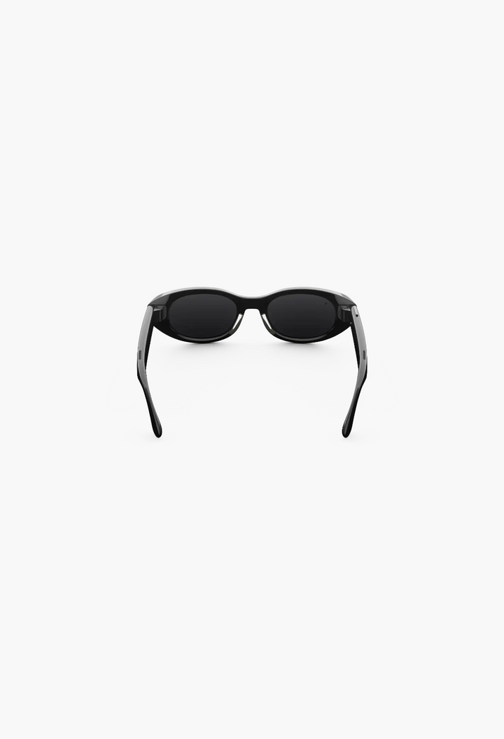 GLAM MODA Starfire Kylie Edition AI smart glasses in black with a slim oval frame, rear view on white background