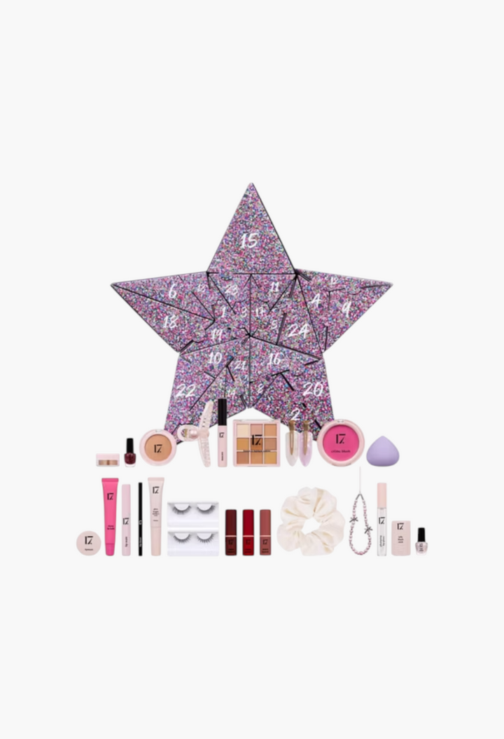 GLAM MODA 17 Xmas Icons star-shaped advent calendar with assorted makeup, nail polish, hair accessories, and beauty tools.