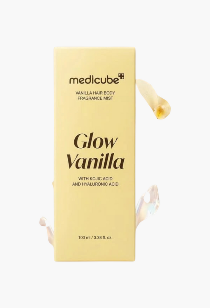GLAM MODA Medicube Glow Vanilla hair and body fragrance mist bottle surrounded by vanilla flowers and crystals