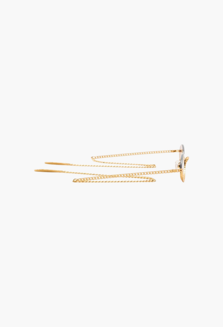 GLAM MODA Gaga sunglasses in gold metal with sculptural frames and elegant attached gold chain side view