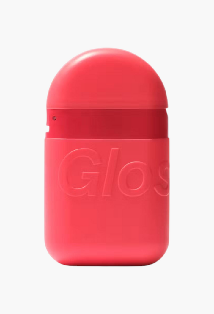 GLAM MODA moisturizing hand cream in a compact, coral-pink, palm-sized squeeze pod with a click-to-close cap.