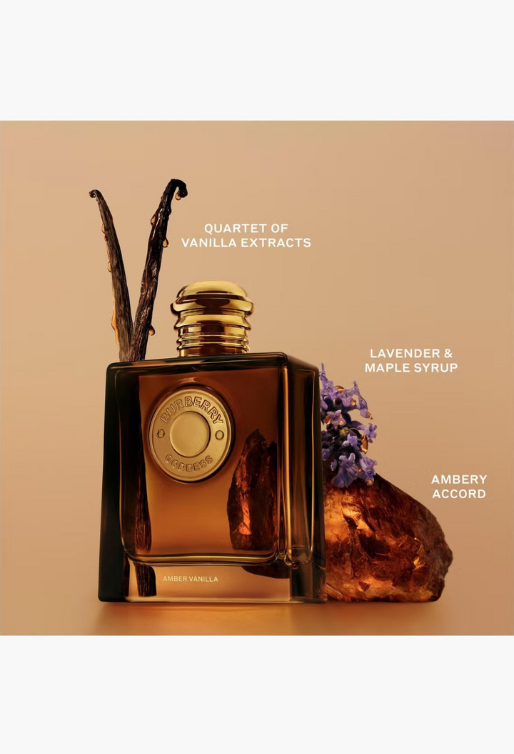GLAM MODA Burberry Goddess Amber Vanilla perfume bottle with vanilla beans, lavender, and amber on a golden background.