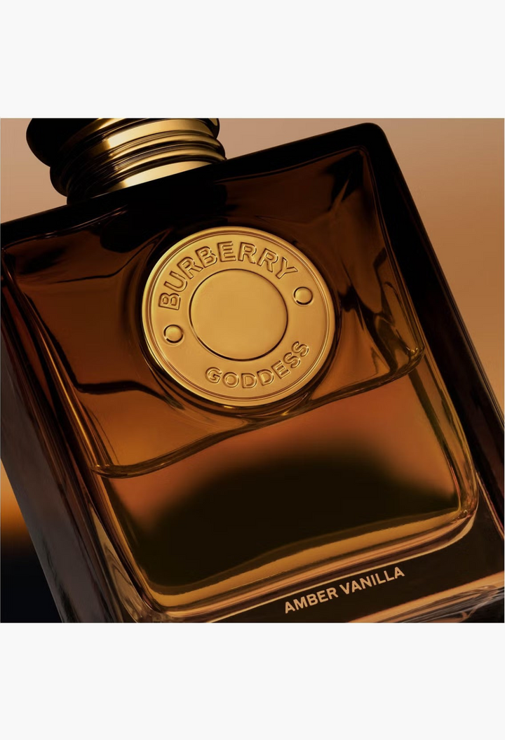 GLAM MODA Burberry Goddess Amber Vanilla perfume bottle with golden medallion and amber glass square design