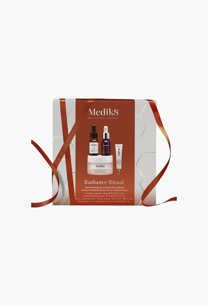 GLAM MODA Medik8 Radiance Ritual skincare gift set featuring four hydrating and brightening facial treatment products.