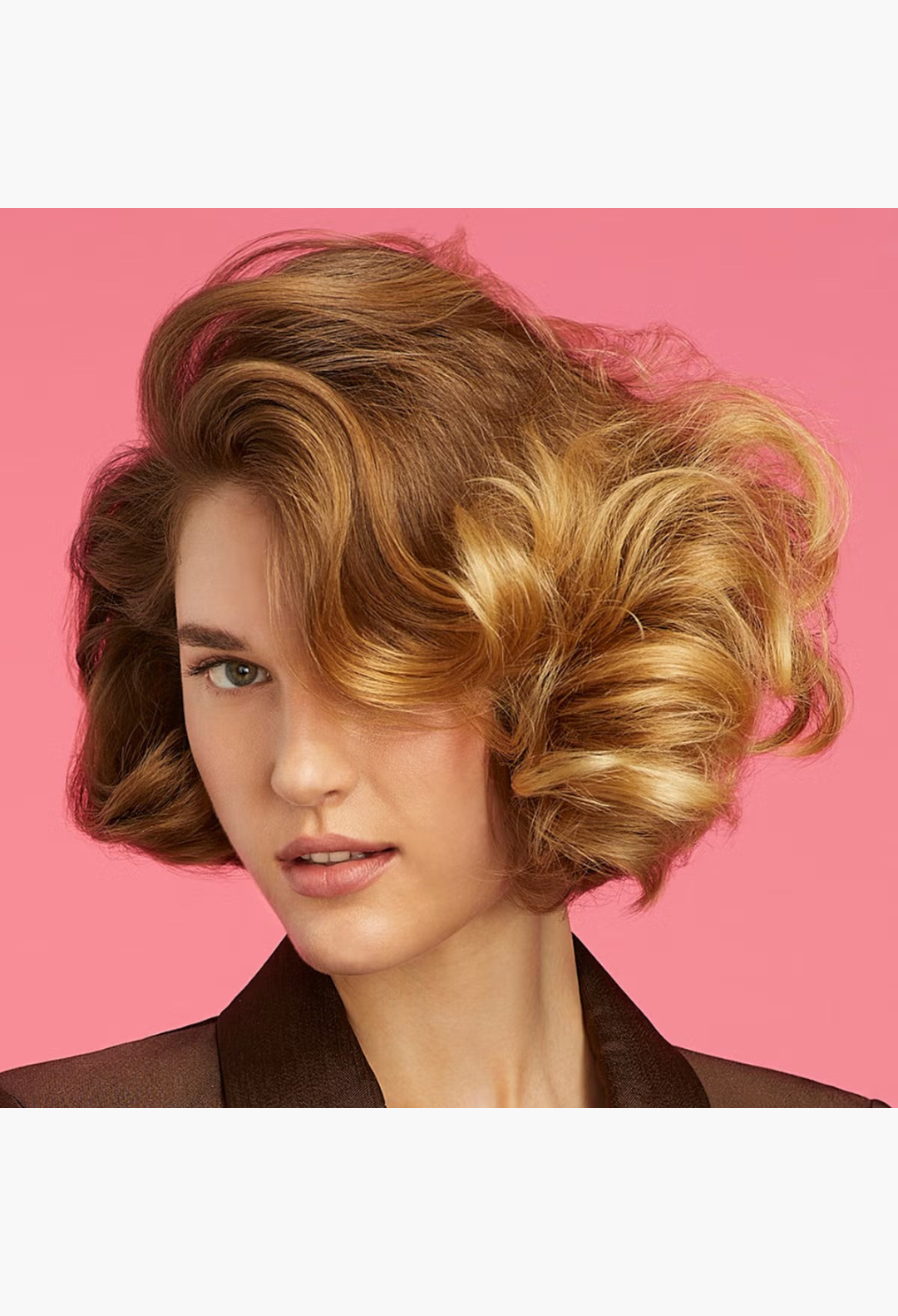 GLAM MODA model with voluminous, bouncy blonde hair styled using Hair By Sam McKnight Cool Girl Volumising Cream