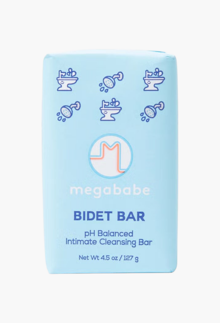 GLAM MODA Megababe Bidet Bar, a light blue pH balancing feminine cleansing soap bar with cute bathroom icons.