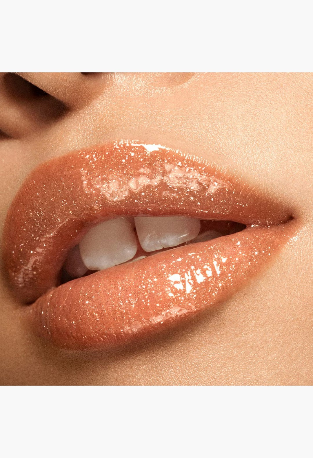 GLAM MODA VIEVE Lip Dew on lips with a high-shine, shimmering nude finish and a non-sticky, glossy texture.