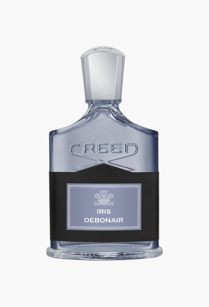 GLAM MODA Creed Iris Debonair Eau De Parfum in a clear glass bottle with a black leather label and silver cap.