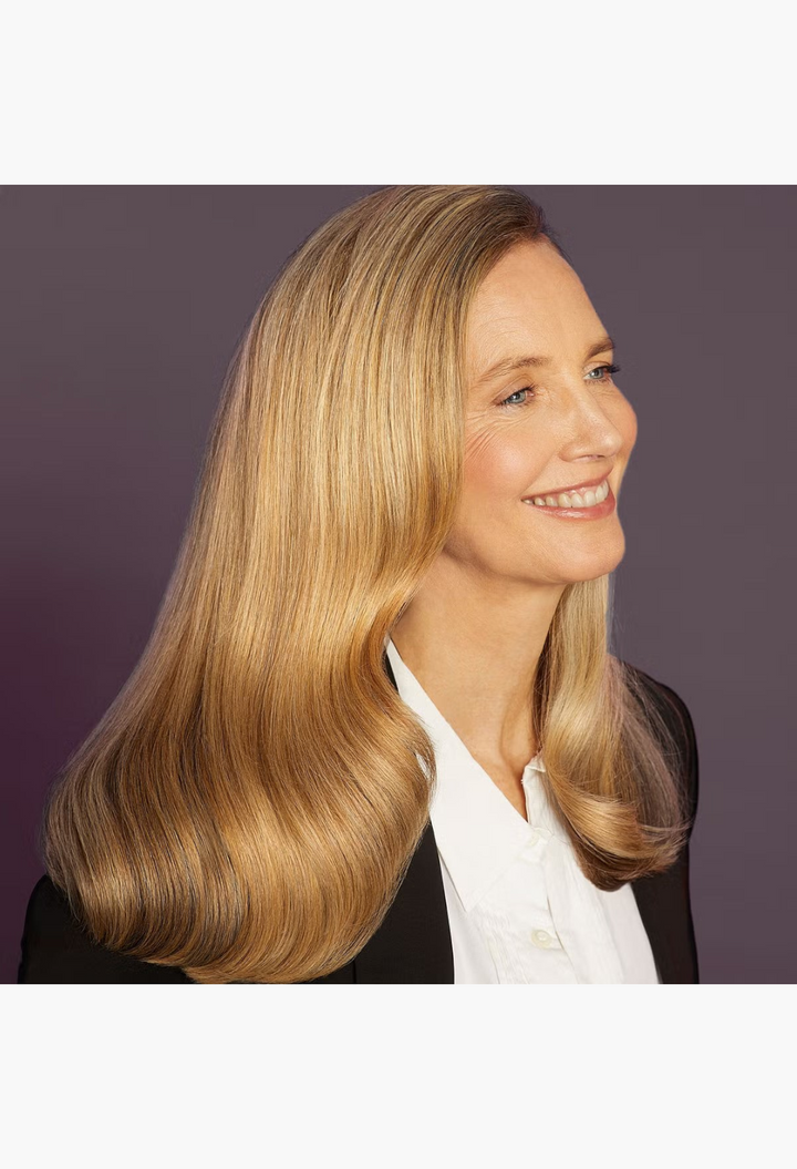 GLAM MODA model with smooth, healthy blonde hair styled using Hair by Sam McKnight Stronger Love Repair Spray