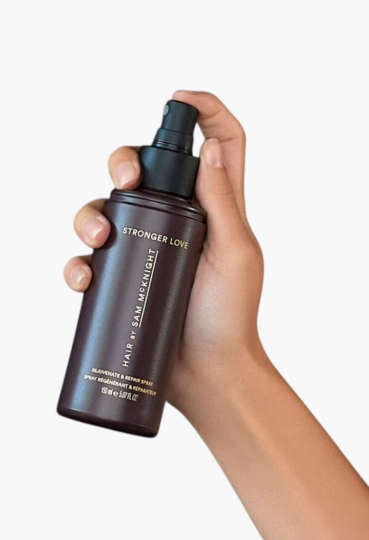 GLAM MODA Hair by Sam McKnight Stronger Love Rejuvenate & Repair leave-in hair treatment spray in a dark bottle