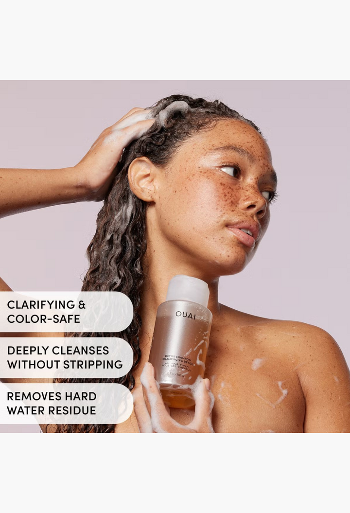 GLAM MODA model using OUAI Detox Shampoo with rich lather on wet hair, highlighting clarifying and color-safe benefits