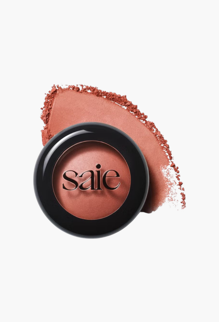 GLAM MODA Saie SuperSuede Radiant Blush powder in a compact with a soft terracotta pigment swatch on a white background