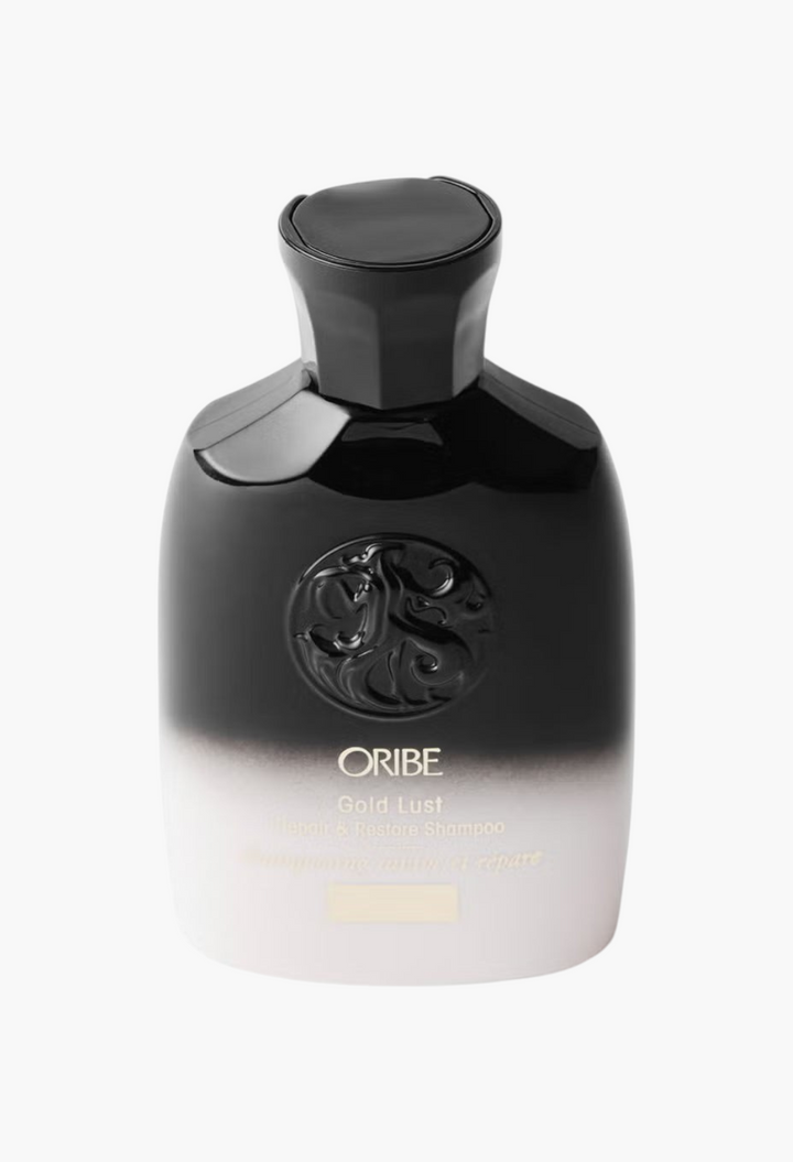 GLAM MODA Oribe Gold Lust Repair and Restore Shampoo travel size bottle with signature black and white gradient design