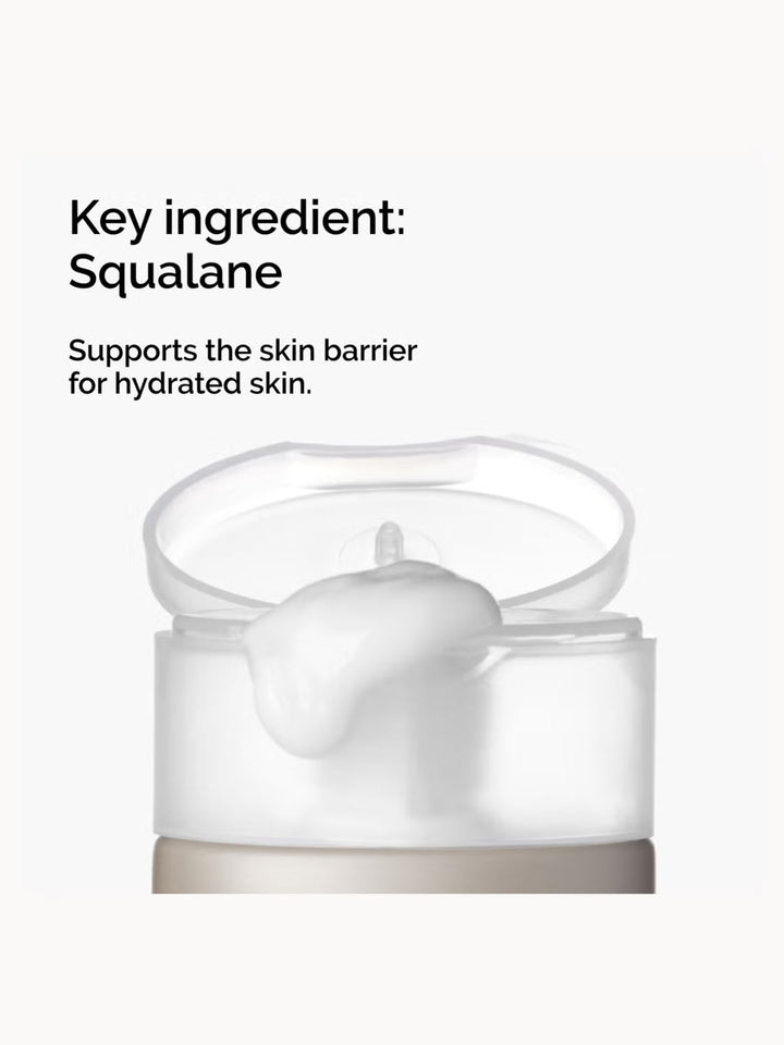 GLAM MODA The Ordinary Squalane Cleanser bottle with white cream dispensing from the open cap for skin hydration.