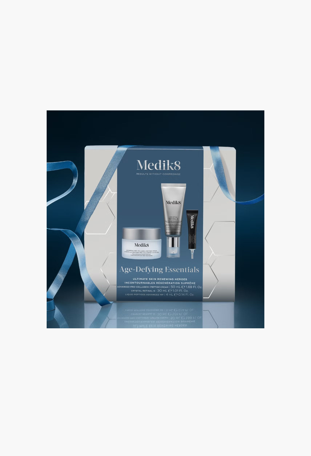 GLAM MODA Medik8 Age-Defying Essentials skincare gift set featuring a cream, retinal serum, and peptide treatment.