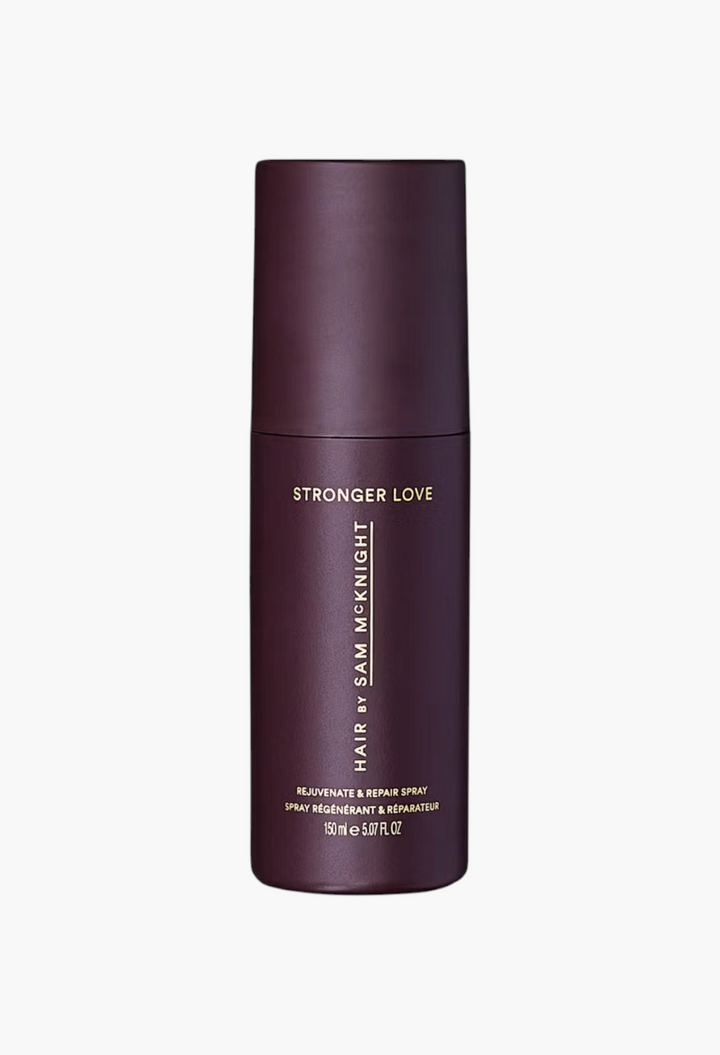 GLAM MODA Hair by Sam McKnight Stronger Love Rejuvenate & Repair Spray in a dark purple 150ml bottle.