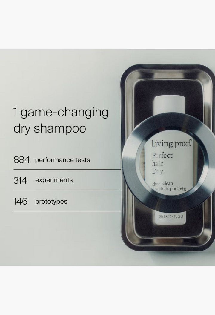 GLAM MODA Living Proof Perfect Hair Day Sheer Clean Dry Shampoo Mist bottle in a metal tray with scientific stats.
