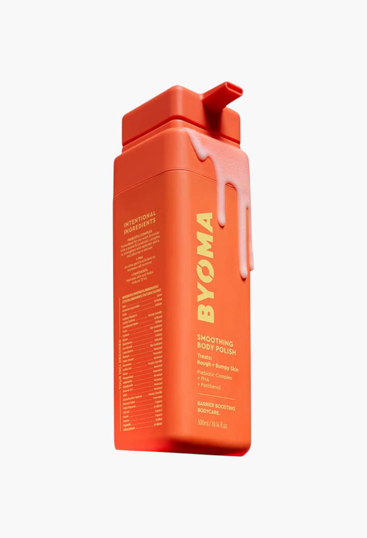 GLAM MODA BYOMA Smoothing Body Polish in a rectangular orange bottle with a pump and dripping cream texture