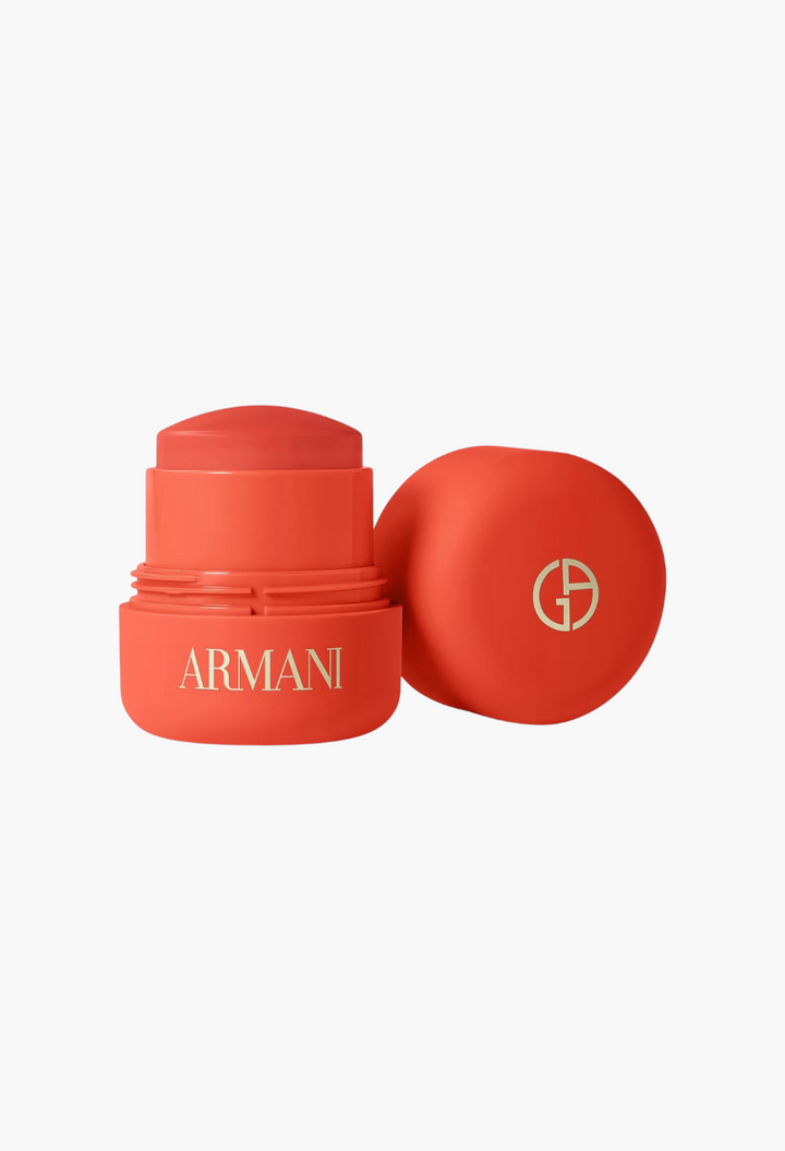GLAM MODA Armani Beauty Dolci Blush in a vibrant coral cream-to-powder stick format with its matching cap.
