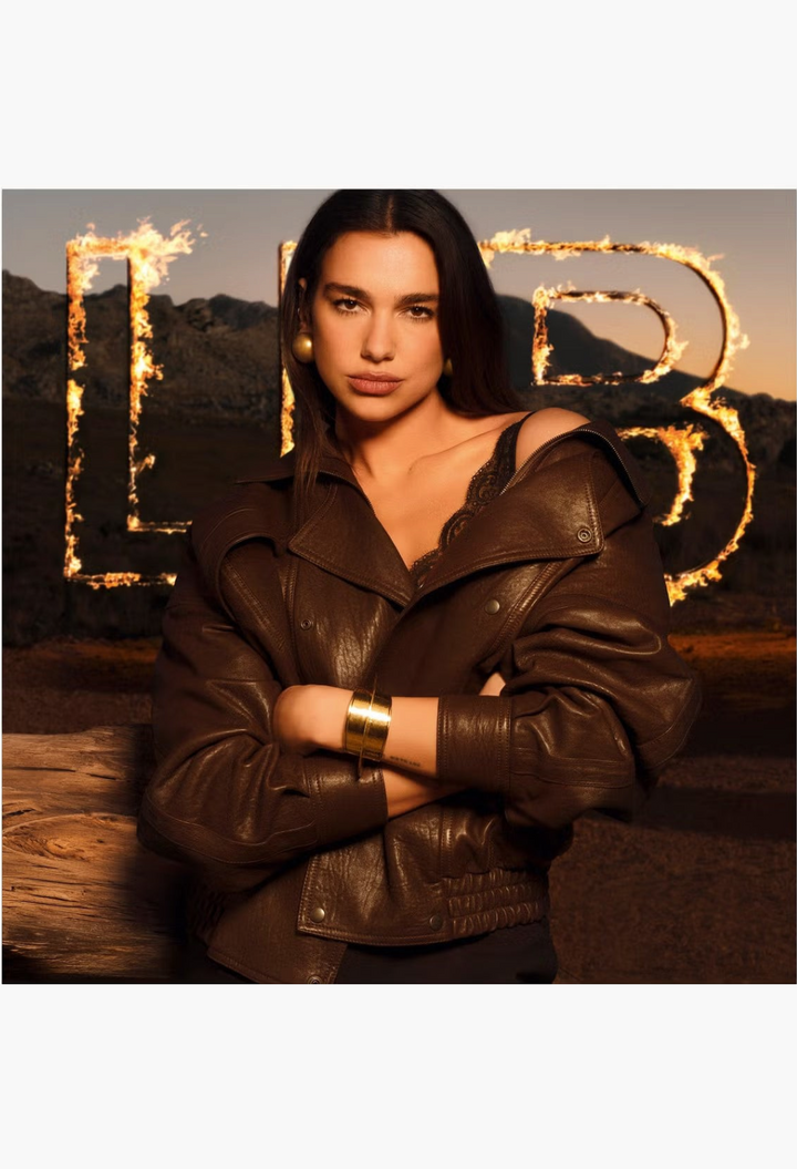 GLAM MODA campaign featuring Dua Lipa wearing a chocolate brown leather jacket to promote YSL Libre Santal Couture