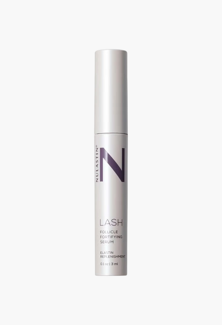 GLAM MODA NULASTIN LASH Follicle Fortifying Serum in a sleek silver tube for longer, thicker eyelashes.