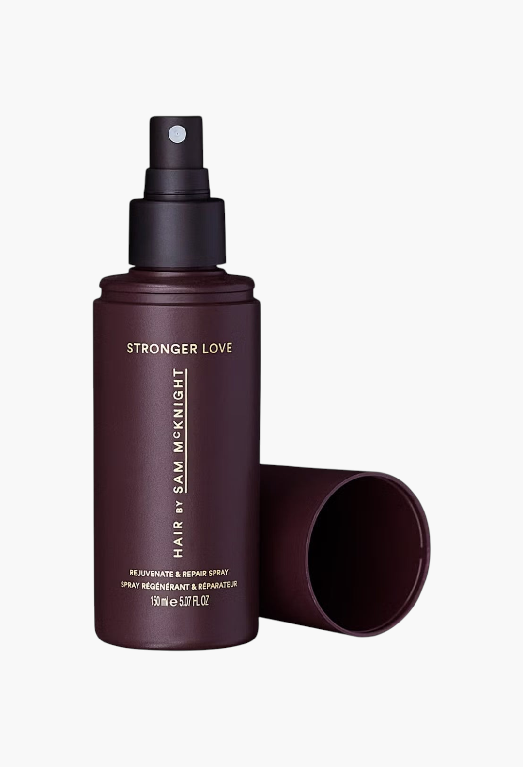 GLAM MODA Hair by Sam McKnight Stronger Love Rejuvenate & Repair Spray in a dark purple bottle with a black cap.
