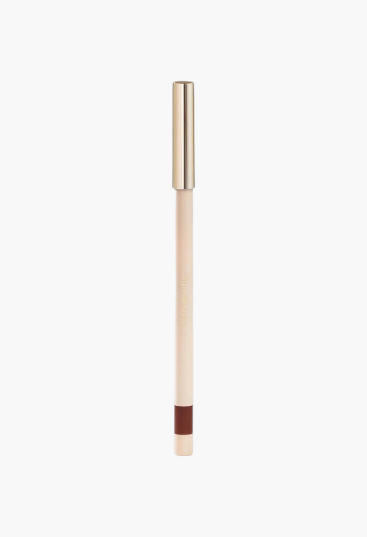 GLAM MODA Kind Words matte lip liner in a deep brown shade with a sleek beige body and gold cap.