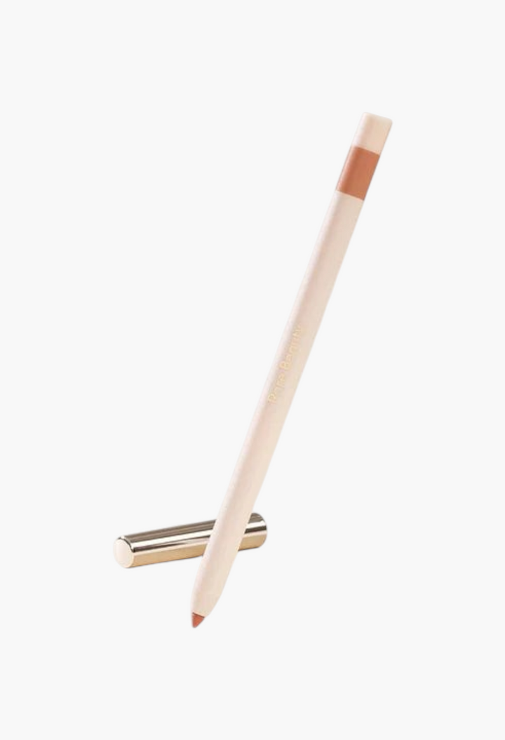 GLAM MODA Kind Words matte lip liner in a neutral beige shade with a sleek retractable design and metallic cap.