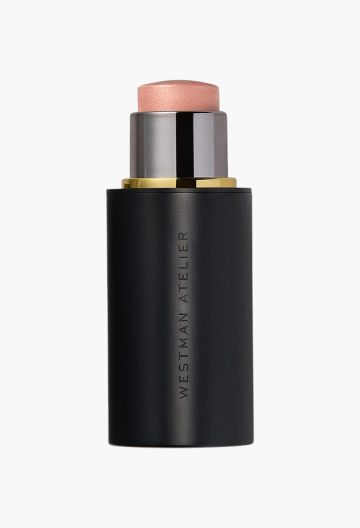 GLAM MODA Lit Up Highlight Stick in a sleek black twist-up tube for a radiant glassy finish on cheeks and lips.