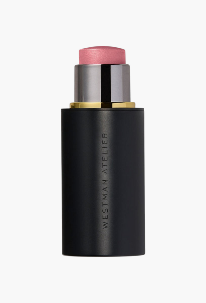 GLAM MODA Lit Up Highlight Stick in a sleek black twist-up tube with a shimmering pink translucent gel highlighter.