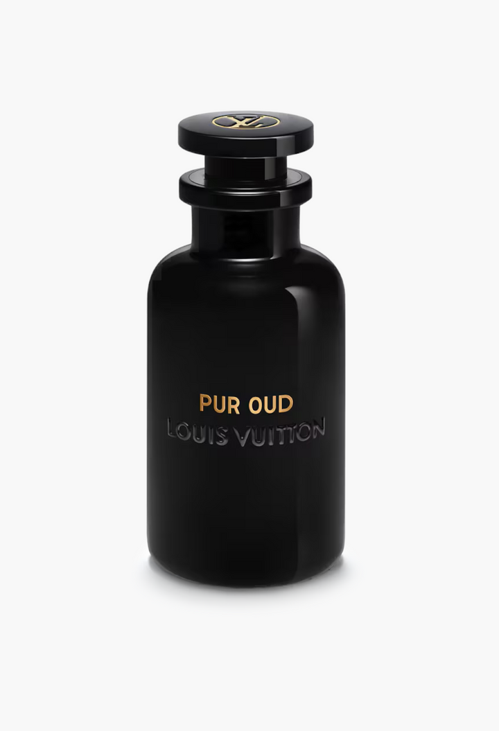GLAM MODA Pur Oud perfume in a sleek black glass bottle with gold lettering and a branded cap.