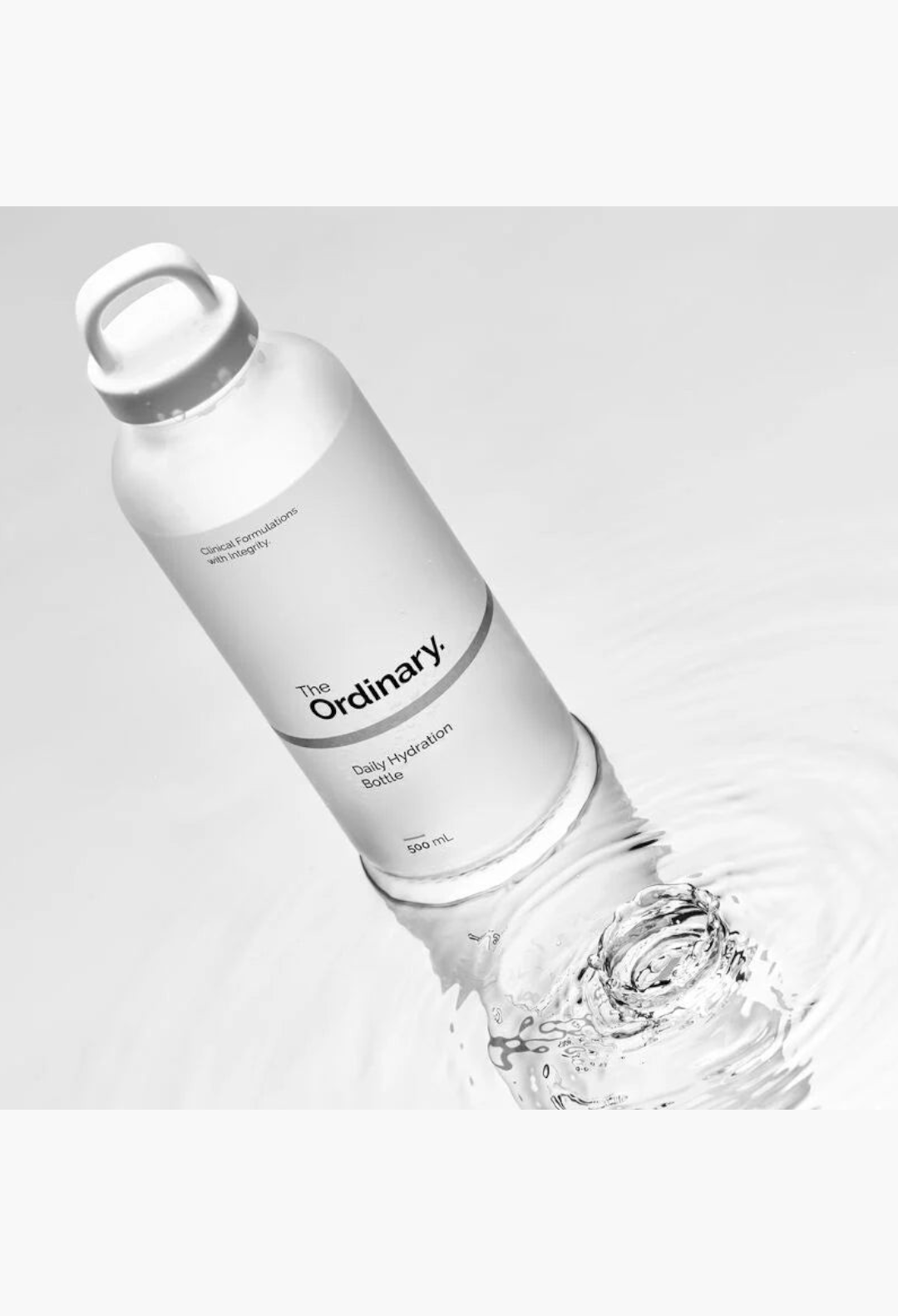 GLAM MODA 500ml frosted glass Daily Hydration Bottle with a white screw cap partially submerged in clear water.
