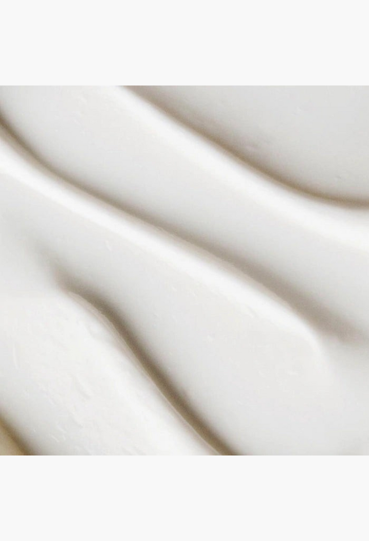 GLAM MODA goat milk moisturizing cream cleanser texture showing a smooth white non-foaming formula