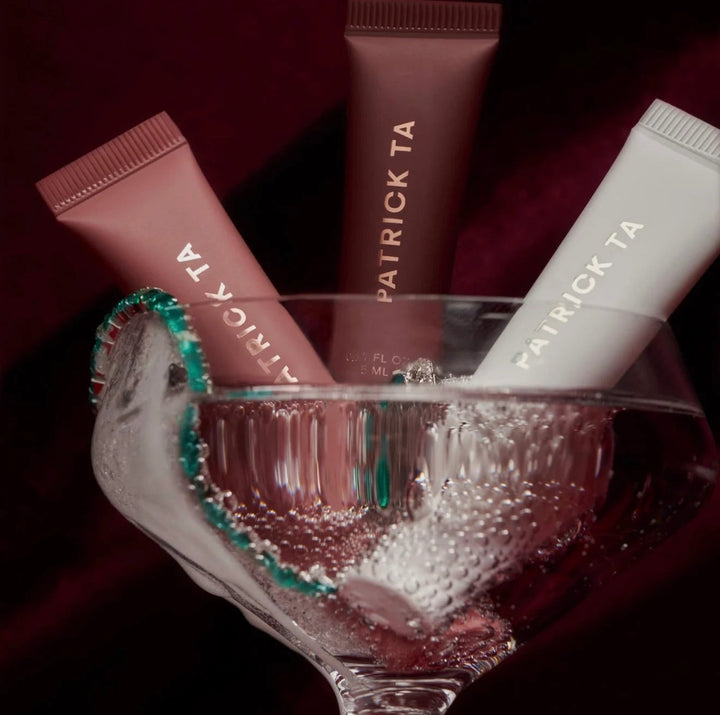 GLAM MODA PATRICK TA tinted lip balm trio in a glass, featuring three hydrating smoothing tubes in varied shades.