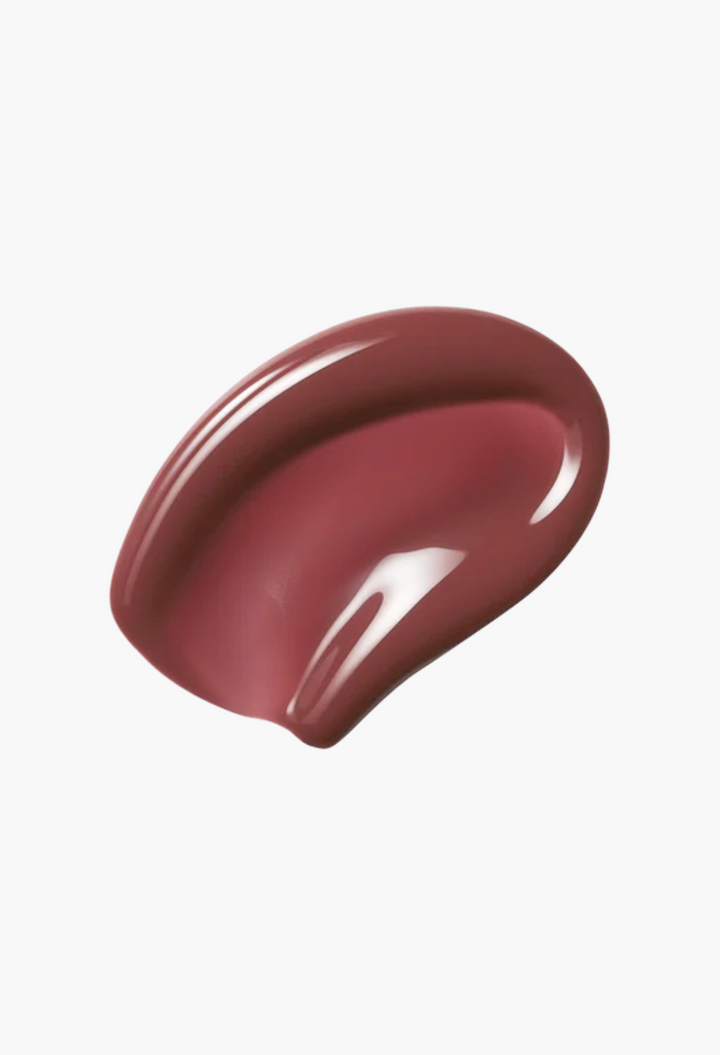 GLAM MODA Posh Gloss high-shine lip gloss swatch in a deep mauve-berry shade with a smooth, reflective finish.