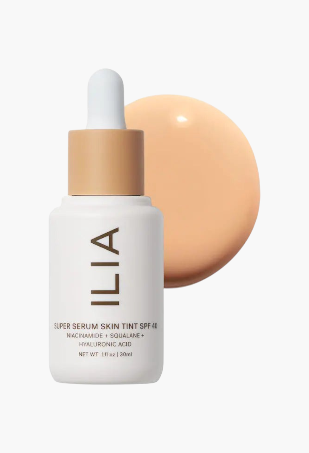 GLAM MODA ILIA Super Serum Skin Tint SPF 40 bottle with a swatch of liquid foundation on a white background.