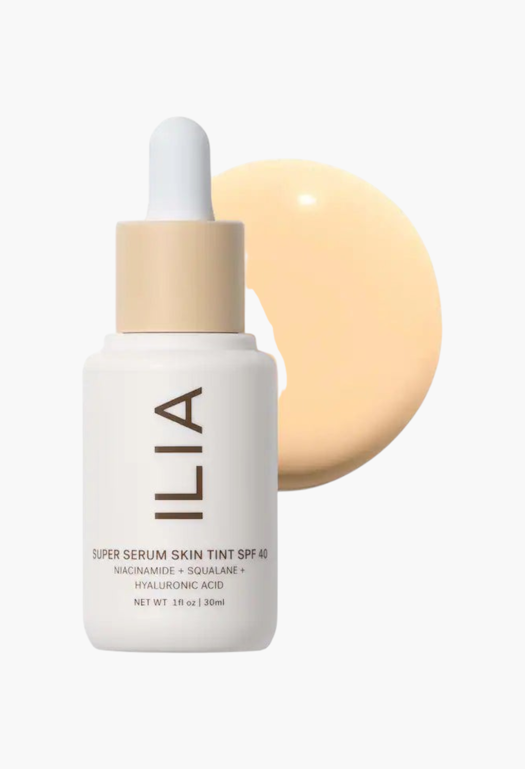 GLAM MODA ILIA Super Serum Skin Tint SPF 40 bottle with a swatch of liquid foundation on a clean white background