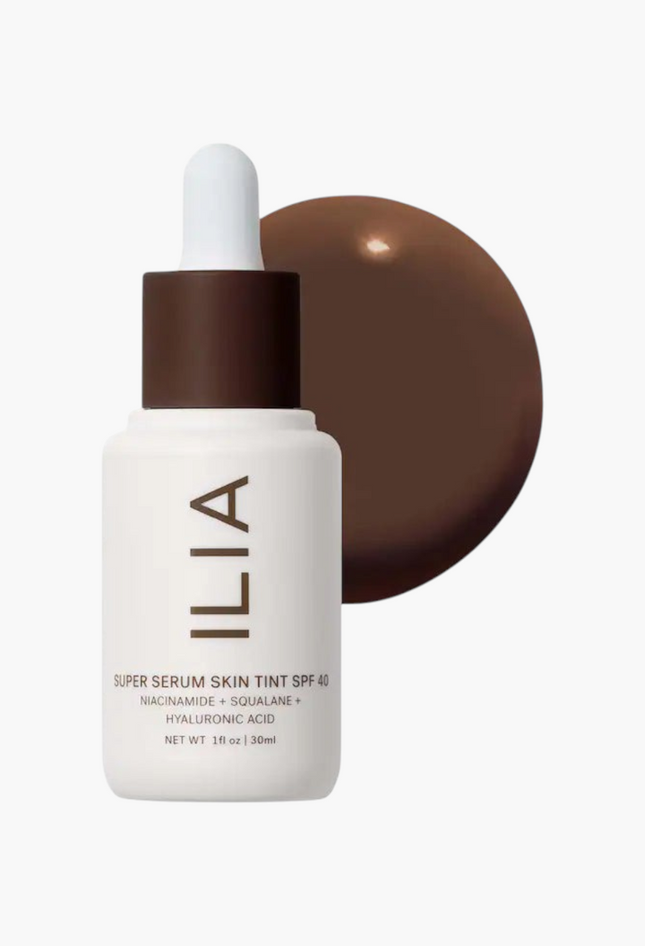 GLAM MODA Super Serum Skin Tint SPF 40 in a dark shade with a dropper bottle and liquid foundation swatch