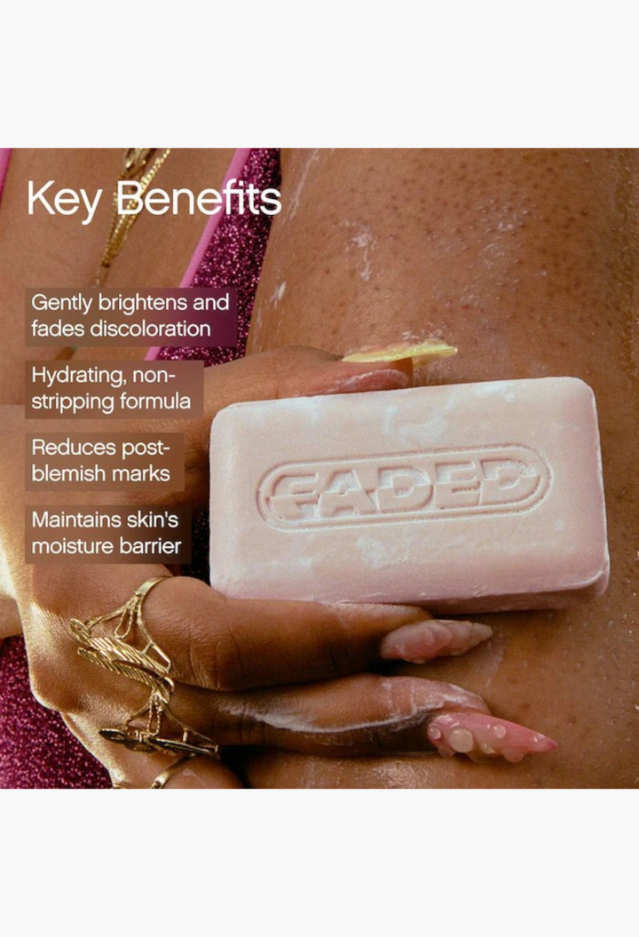 GLAM MODA Faded brightening body bar in hand, formulated to reduce dark spots and hydrate skin with shea butter.