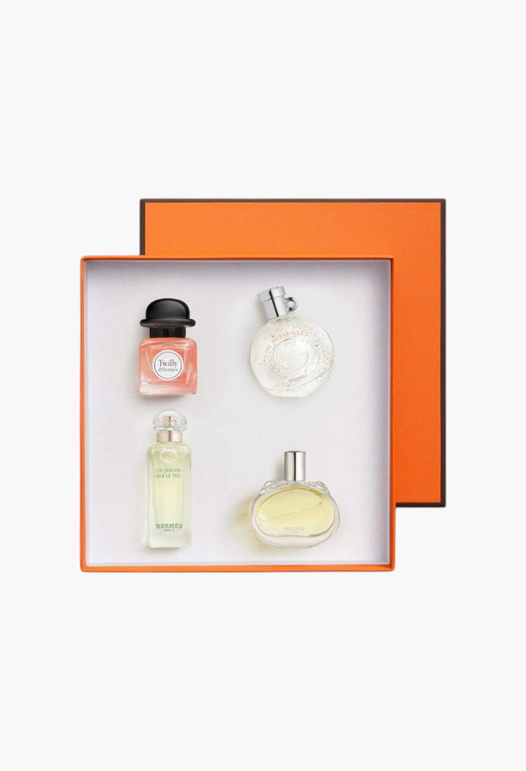 GLAM MODA Hermès fragrance discovery set featuring four mini perfume bottles in a signature orange gift box.