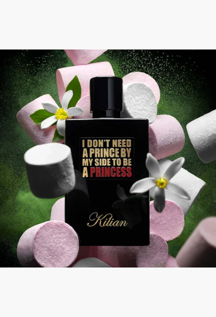 GLAM MODA Kilian Princess perfume bottle surrounded by floating pink marshmallows and white jasmine flowers.