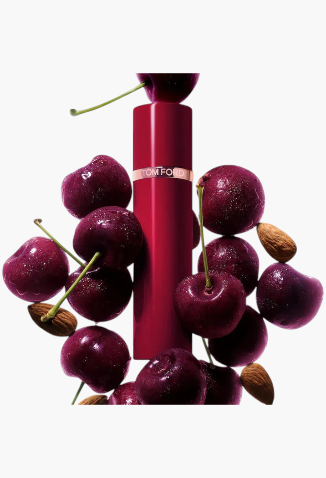 GLAM MODA perfume sampler set featuring a TOM FORD Lost Cherry fragrance bottle surrounded by fresh cherries and almonds