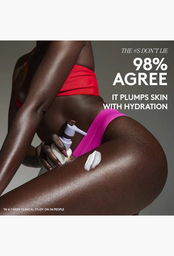 GLAM MODA Butta Drop hydrating body milk applied to skin, showing a creamy white lotion texture on a model's leg.