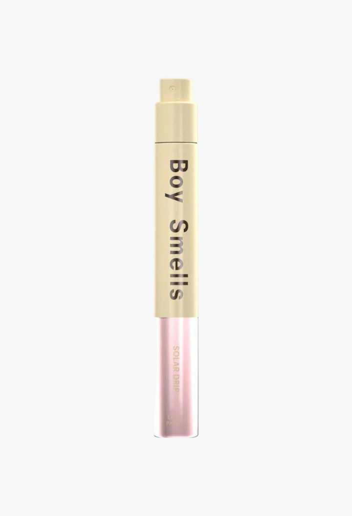GLAM MODA Solar Drip perfume travel spray with a pale yellow cap and a light pink glass base.