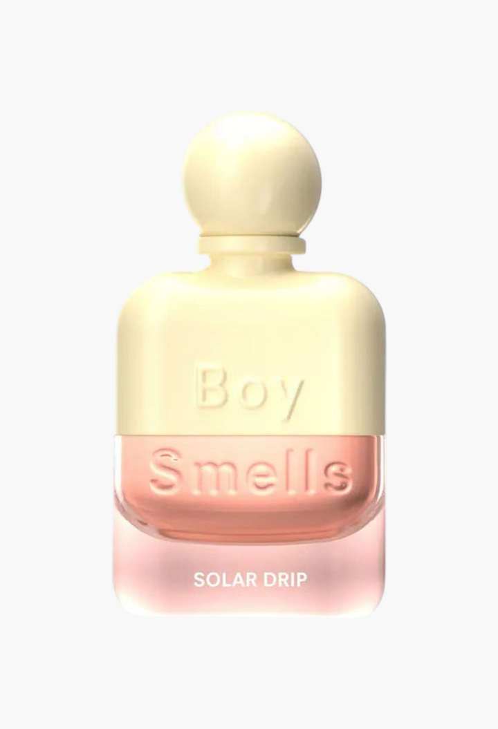 GLAM MODA Solar Drip perfume bottle with a cream cap and soft pink glass containing citrus and orange blossom scent