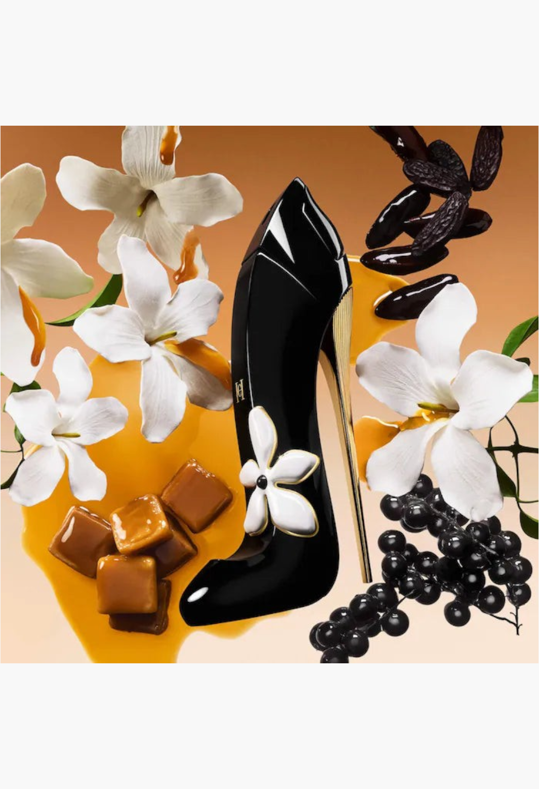 GLAM MODA Golden Hour perfume bottle shaped like a black stiletto heel surrounded by white flowers and caramel cubes.