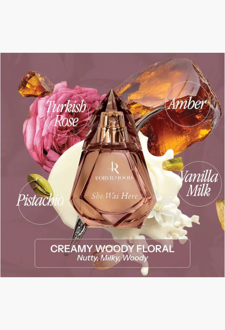 GLAM MODA FORVR Mood She Was Here perfume bottle surrounded by Turkish rose, amber, and creamy floral accents.