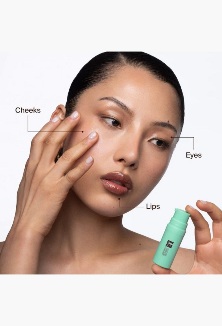 GLAM MODA Hyper Shine Glass Skin Makeup Mixing Serum applied to model's cheek, eyelid, and lips for a dewy finish.