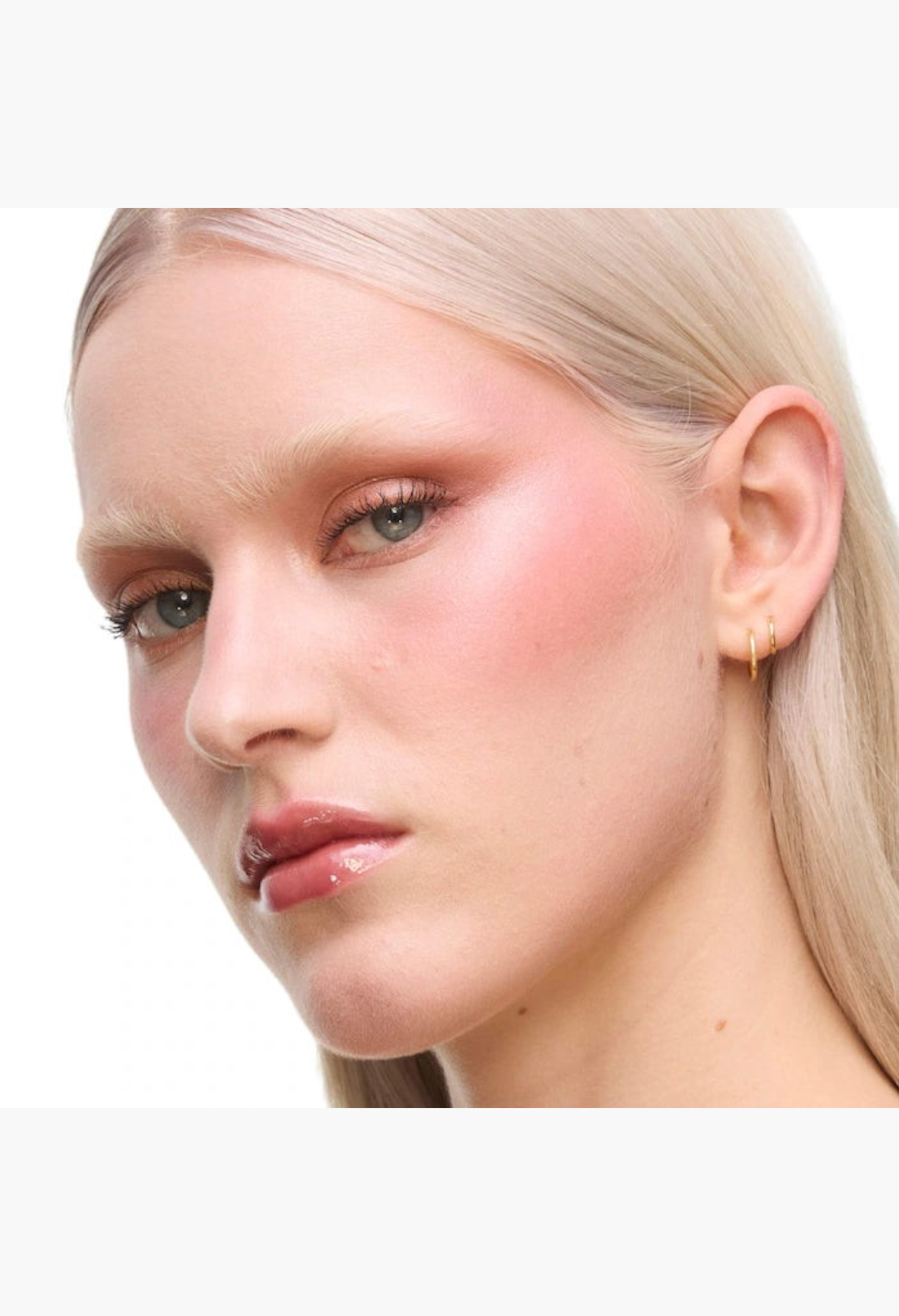 GLAM MODA model wearing YSL Brewed Reflections Couture Face Palette with a soft-diffused pink blush and glowing skin