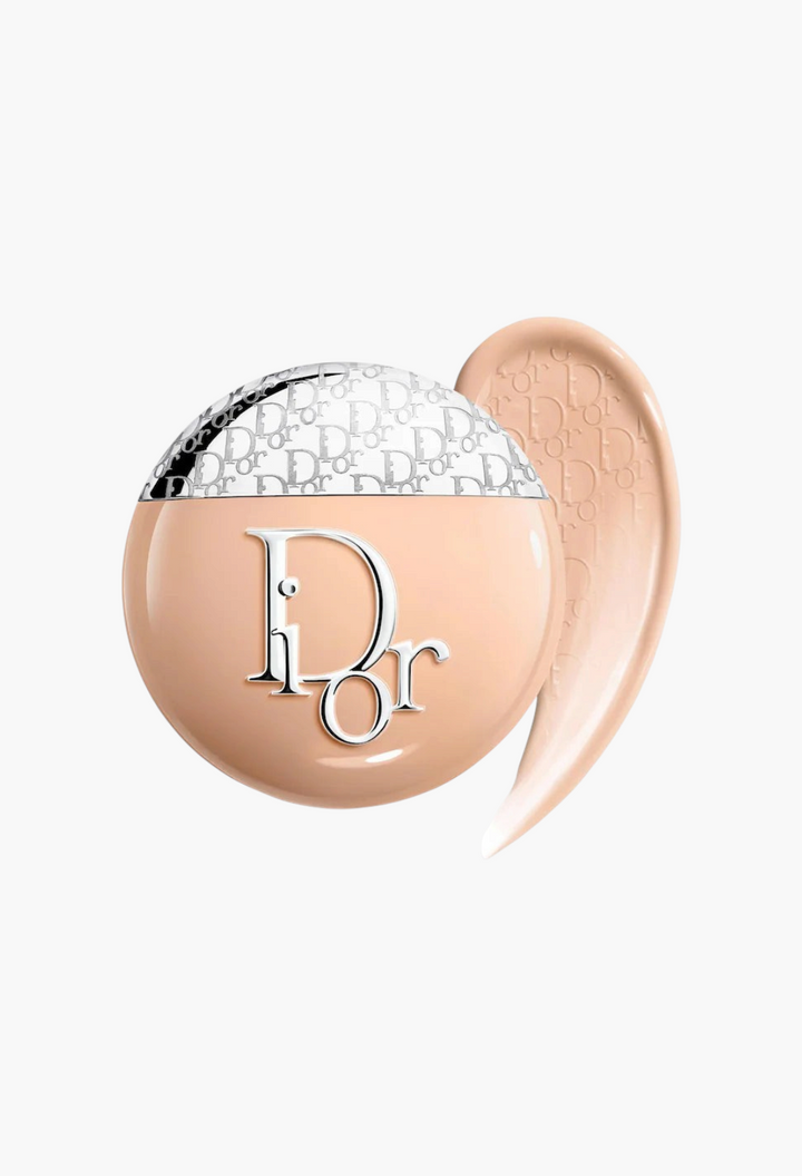 GLAM MODA Dior Backstage Glow-Up Skin Tint liquid foundation with SPF 20 and a swatch of the beige tinted formula.
